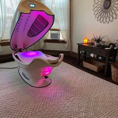 The Cocoon infrared wellness pod open in its room at Harbor Light